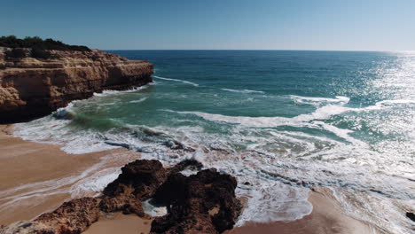 Waves-crashing-onto-rocks-at-the-Alba-resort-in-Algarve,Portugal
