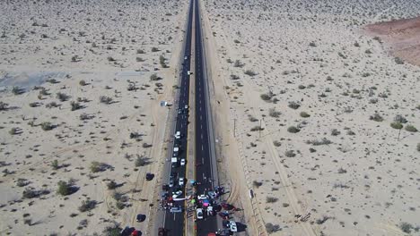 View-of-a-drone-descending-over-a-highway-during-a-manifestation