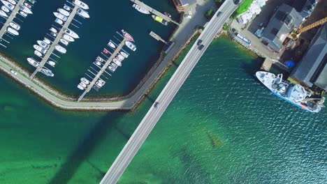 Birds-Eye-Aerial-View-of-Traffic-on-Gisundbrua-Bridge,-Connecting-Senja-and-Lofoten-Islands-to-Mainland-Norway,-Top-Down-Drone-Shot