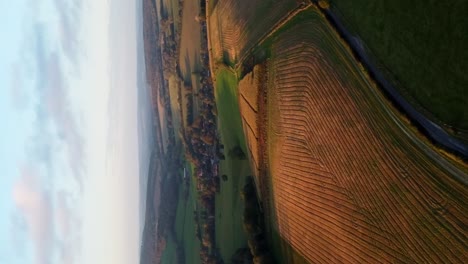 Vertical-Shot-Agricultural-Farmland-Countryside-At-Sunset-In-West-Sussex,-England