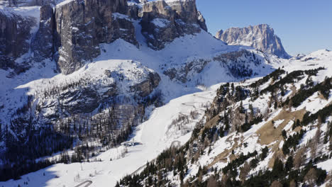 Aerial-Drone-View-Of-Winter-Ski-Slopes-Of-The-Dolomites-Mountains-In-Passua,-Italy