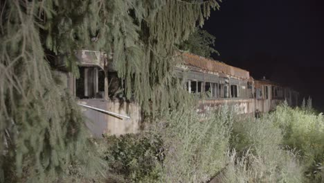 Old-rotten-tram-in-night-forest-horror-location