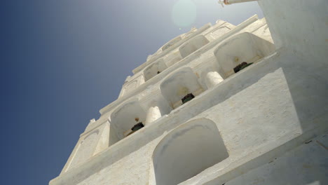 Bell-tower-with-six-bells-in-Oia-village,-Santorini,-Greece