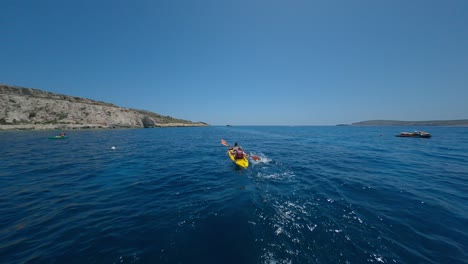Aerial-Of-Two-People-Kayaking-In-The-Sea-1