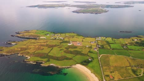 Descending-aerial-view-in-4K-of-Silver-Silver-strand-and-Sherkin-north-shore-in-Sherkin-Island,-South-West-Cork,-Ireland