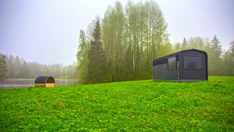 Timelapse-shot-of-a-man-mowing-tall-grass-around-a-wooden-cabin-in-timelapse-throughout-various-season-in-rural-countryside