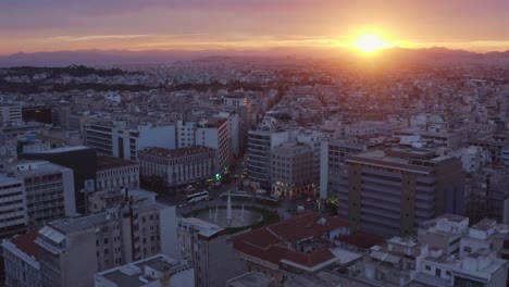 Aerial---Omonoia-Square-in-Athens,-Greece-at-sunset