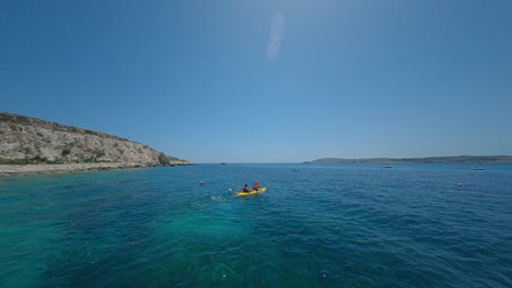 Aerial-Of-Two-People-Kayaking-In-The-Sea