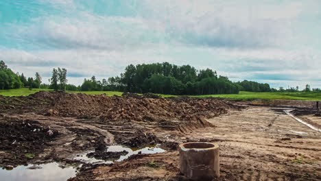 Time-Lapse-of-Construction-Site-in-Initial-Phase,-Excavator-Levelling-Ground-in-Countryside-Landscape