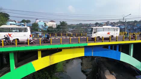 Busy-Morning-Traffic-Travels-Across-Bridge-in-Malang,-Indonesia