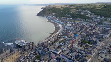 Drone-footage-on-a-summer-day-in-UK-Wales-Aberystwyth-around-the-beach,-harbour,-sea-side,-clif-and-town-front-19