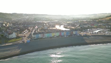 Drone-footage-on-a-summer-day-in-UK-Wales-Aberystwyth-around-the-beach,-harbour,-sea-side,-clif-and-town-front-1