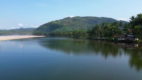 Smooth-Calm-Estuary-Water-with-Mountain-in-Background