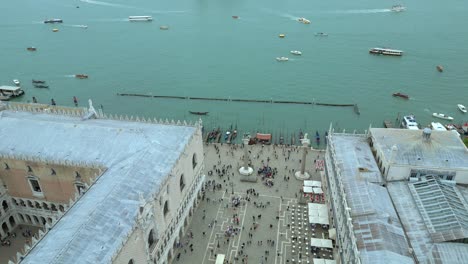 4K-Aerial-of-San-Marco,-the-Rialto-Bridge,-and-the-canals-in-Venice,-Italy-on-a-cloudy-day-14