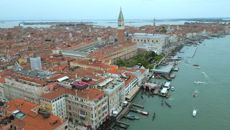 4K-Aerial-of-San-Marco,-the-Rialto-Bridge,-and-the-canals-in-Venice,-Italy-on-a-cloudy-day-10