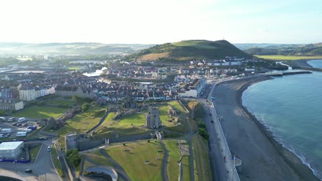 Drone-footage-on-a-summer-day-in-UK-Wales-Aberystwyth-around-the-beach,-harbour,-sea-side,-clif-and-town-front-12