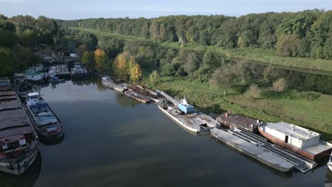 Aerial-view-of-the-morning-marina-and-anchored-towboats-in-a-bay-on-the-Elbe-River