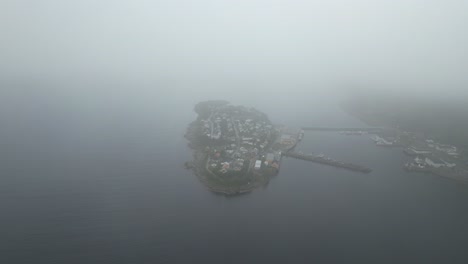 Aerlia-shot-of-Husøy-on-Senja-in-Norway-out-of-clouds-|-Dji-Air2s