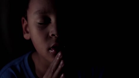 Little-boy-praying-to-God-with-hands-together-stock-footage-8