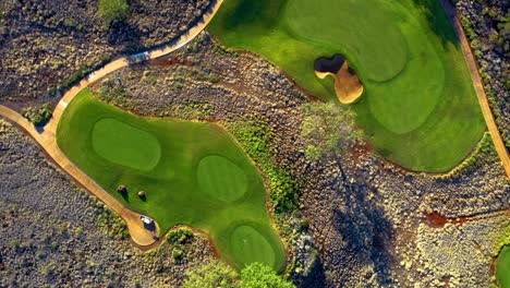 Twisting-aerial-top-down-riser-above-Manele-Golf-Course,-Lanai,-Hawaii