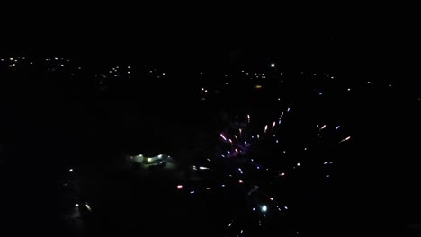 Drone-shooting-around-fireworks-in-Omurtag,-Bulgaria,-aerial-night-footage,-filming-over-the-fireworks
