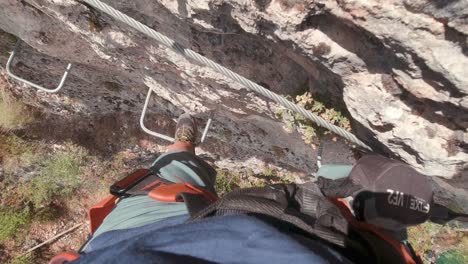 POV-action-cam-young-climber-in-Via-Ferrata-rock-wall-1