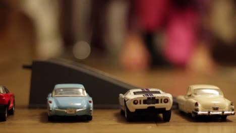 Child-Kid-Plays-With-a-Small-Toy-Cars