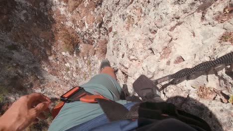POV-action-cam-young-climber-in-Via-Ferrata-rock-wall