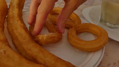 A-plate-of-churros-and-porras-with-sugar-for-breakfast