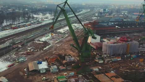 Drone-flying-around-moving-crane-in-the-shipyard