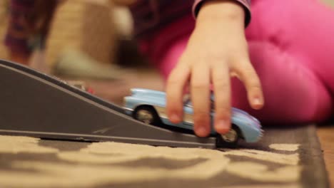 Child-Kid-Playing-With-a-Toy-Car