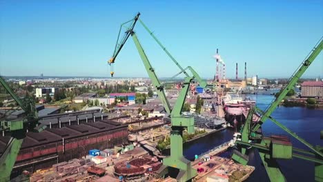 Drone-flying-back-off-the-shipyard-and-cranes