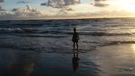 Child-Playning-on-Beach-at-Sunset