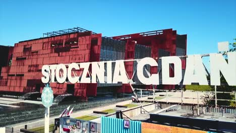 Drone-flying-from-the-Stocznia-Gdanska-sign-to-the-shipyard-panorama