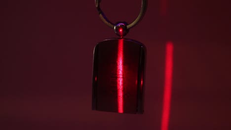 Close-Up-of-the-Hungary-Metal-Souvenir-Keychain-and-the-Vertical-Laser-Light