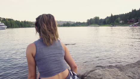 Cute-hipster-girl-enjoying-the-view-of-the-water