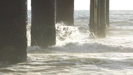 Dramatic-waves-crashing-into-a-pier-piling