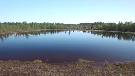 Drone-flight-over-a-lake-in-Finland-in-boreal-zone