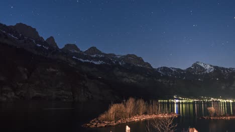 Motion-controlled-timelapse-of-mountains-behind-a-lake-during-twilight-in-Switzerland-until-the-nightsky-appears