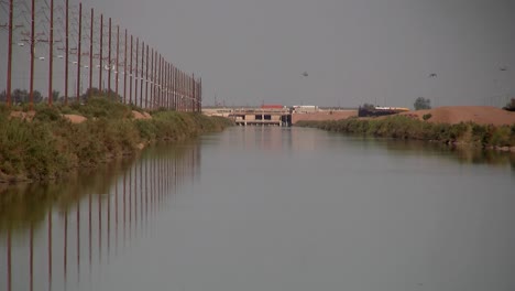Irrigation-canal-in-California-near-the-Mexican-Boarder,-USA