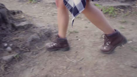 A-handheld-shot-of-a-cute-hip-girl's-feet-walking-through-a-park