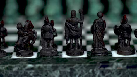 Ancient-marble-chessboard-with-teal-bronce-knights-as-pawns-slider-macro-4