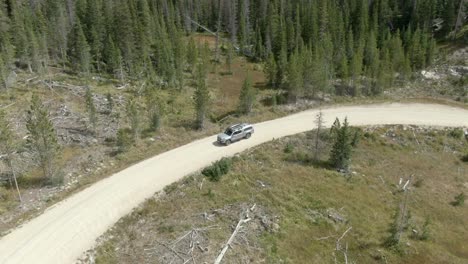 Aerial-of-guy-driving-truck-off-road-in-Colorado