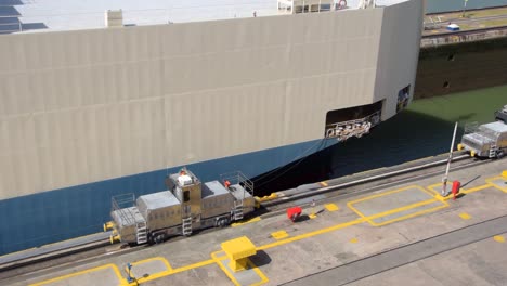 A-huge-cargo-ship-transporting-cars-just-crossing-one-of-the-gates-at-the-Panama-Canal