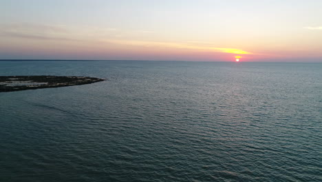 Aerial-shot-of-Sunset-over-beach