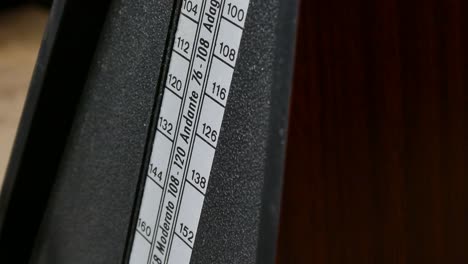 Side-view-of-a-working-metronome
