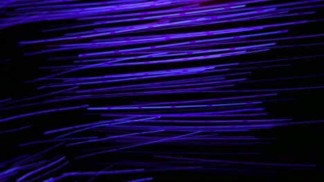Beautiful-background-with-colorful-fiber-optic-light-rays-in-movement