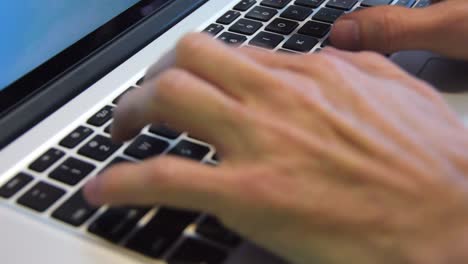 Close-up-shot-of-both-hands-typing-in-a-laptop-keyboard