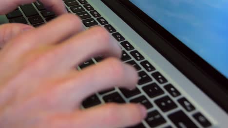 Close-up-shot-of-both-hands-typing-in-a-laptop-keyboard-1