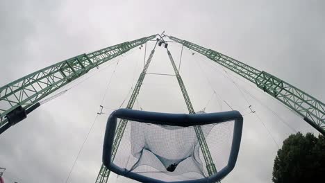 Man-jumps-into-a-giant-hanging-trampoline-at-the-amusement-park-1